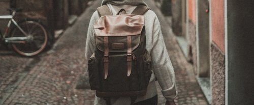 Person holding a backpack in Italy